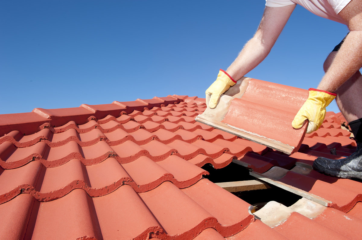 Cedarline Roofing professional sealing a roof during reliable repair work in Midland, TX, enhancing home safety, Experienced roofer assessing roof decking and flashing for full system replacement